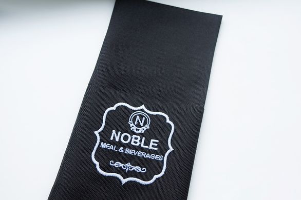 Cutlery holder with embroidered logo